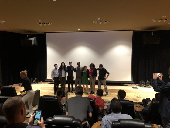 Cast and crew lined up on the screening-room stage for a Q and A